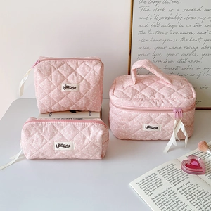 Pink quilted floral makeup bag set with top handle and zip closure in three sizes