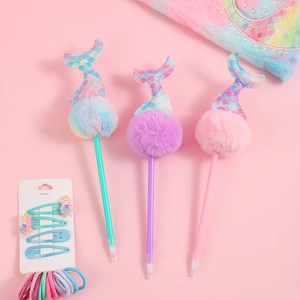 Three colorful mermaid tail pens with fluffy pom-poms in pastel mint, purple, and pink