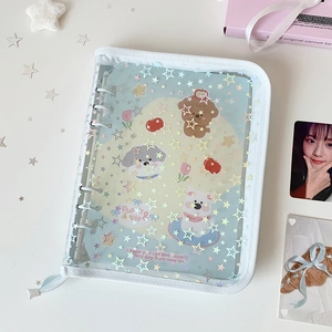 Detail of A5 binder with laser star pattern, zipper closure and cute cartoon inner pages