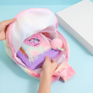 Rainbow plush unicorn backpack set with notebooks and a pink pompom accessory