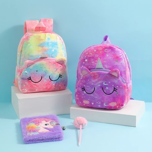 Detail of plush unicorn backpacks and matching notebooks set for kids in pastel colors
