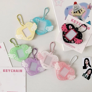 Cute heart-shaped acrylic photocard holders with wings and glitter in seven pastel colors