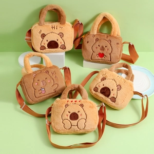 Detail of plush capybara crossbody bags with cute animal embroidery and soft texture