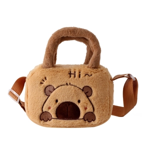 Detail of soft plush bear crossbody bag showing fine embroidery and fuzzy texture
