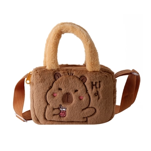 Detail view of plush capybara shoulder bag with cartoon embroidery and adjustable strap