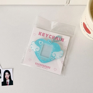 Detail of light blue heart photo card holder with wings and glittery acrylic finish
