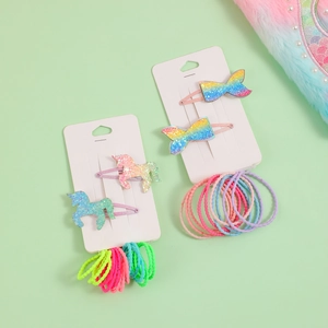 Set aus Regenbogen-Haarspangen mit Einhorn und Schleifen sowie bunten Haargummis für Mädchen