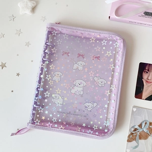 Macro shot of purple holographic A5 binder featuring a cute dog and star patterns