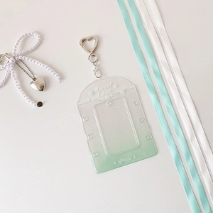 Detail of mint green glitter card holder with silver heart clip and Sweet Love text