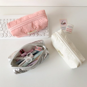 Three-piece set of embossed butterfly pencil cases in pink, cream, and metallic silver