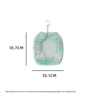 Detail of mint green photocard holder showing star-shaped window and size measurements