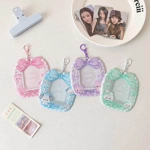 Detailed macro view of cute cartoon PVC card holders with bow decorations and metal clasps