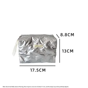 Silver quilted cosmetic bag with butterfly patterns and dimensions of 17.5x13x8.8cm