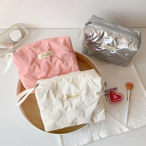 Quilted butterfly cosmetic bags in pink white and grey with elegant ribbon zippers