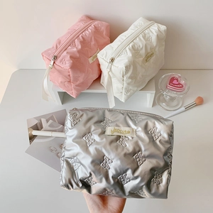 Quilted bow makeup bag in pink white and silver with waterproof glossy finish