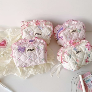 Quilted butterfly cosmetic bags with ruffle edges and pastel patterns in a flat lay view