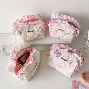 Quilted butterfly print makeup bag with floral ruffles and a sweet aesthetic design