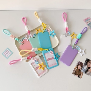 Close-up of colorful star pendant card holders with woven straps in candy colors