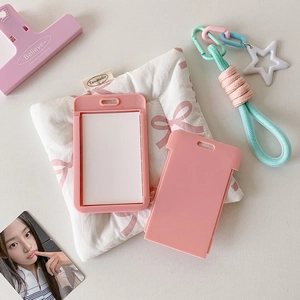 Pink star-themed card holder with colorful braided lanyard and white star charm detail