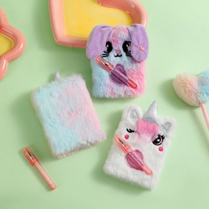 Detail of plush mini notebooks and matching pens in soft macaron colors for students