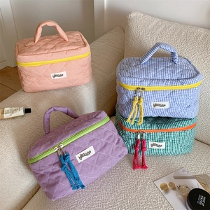 Quilted checkered toiletry bag set with handles and tassels in four pastel colors