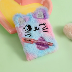 Close-up of plush cat mini notebook with gradient faux fur and glitter heart pen holder