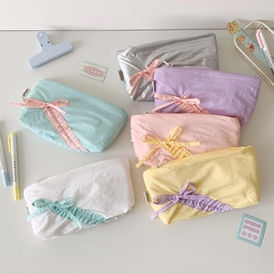 Large capacity drawstring pencil case in six vibrant pastel colors with bow decoration