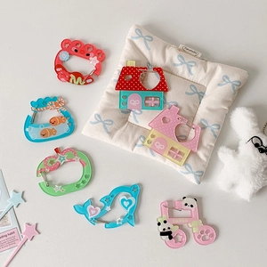 Detailed view of colorful acrylic carabiners in diverse cartoon shapes with metal clips