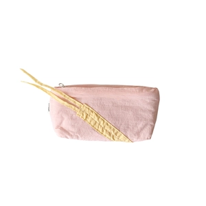 Pink fabric pencil case with yellow strap and zipper for stationery storage