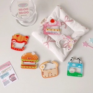 Detailed top view of cute acrylic burger and fries charms with metal carabiner clips
