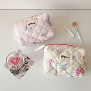 Quilted butterfly cosmetic bags in pink and cream with elegant ribbon zippers