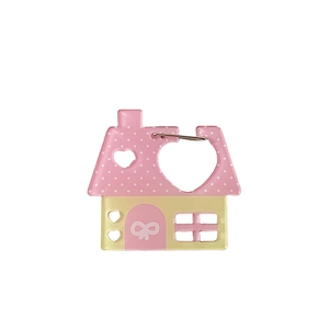 Cute pink house-shaped acrylic keychain with bow pattern and white polka dot roof design