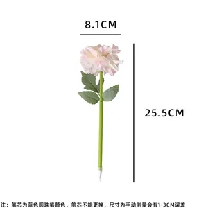 Detail of pink carnation ballpoint pen showing size specs and blue ink features