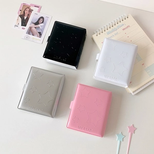 Detail view of MY STAR 3-inch photo albums in black, white, silver, and pink colors