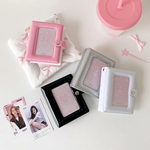 Close-up of star cutout binder albums with metal snap closure in four pastel colors