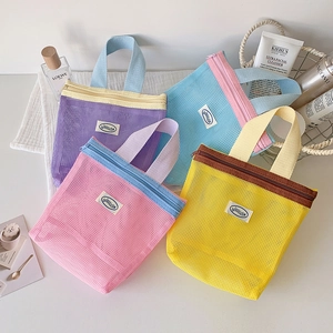 Set of four portable mesh organizer bags with vibrant contrast colors and zipper handles