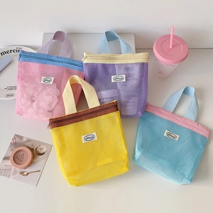 Set of four colorful breathable mesh storage bags with zipper and handle for travel
