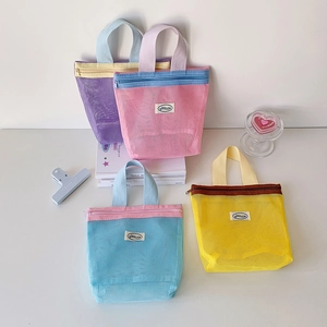 Close-up of four colorful nylon mesh tote bags with zipper closure and durable handles