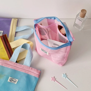 Portable nylon mesh toiletry bag set with zipper closure and woven handles in multiple colors