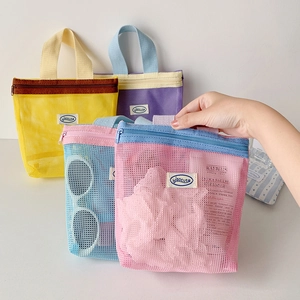 Portable nylon mesh organizer bags in assorted colors with zippers and carry handles