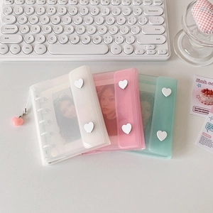 Three mini photo albums in clear white pink and mint green with heart buckles and charms