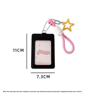 Detail of black faux leather card holder with star charm, showing dual slots and clear window