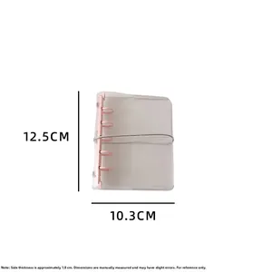 Detailed view of clear PVC binder with pink rings and elastic band, dimensions 12.5x10.3cm
