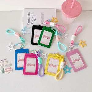 Close-up of colorful PU leather ID card holders with braided lanyards and star charms