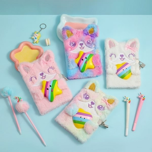 Detail of A5 plush journals with animal embroidery, metal padlocks, and unicorn pens