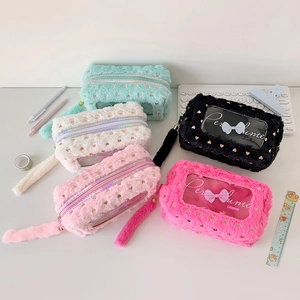 Detail of plush pencil cases with heart foil patterns and transparent PVC windows