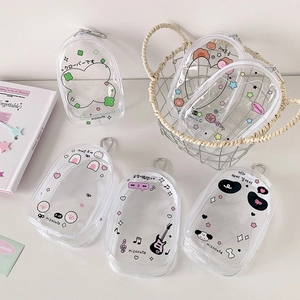 Detailed view of clear PVC cartoon pouches with metal hooks and colorful zipper closures
