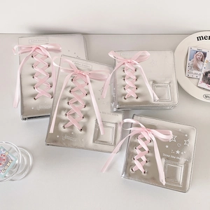 Macro detail of silver A5/A7 binder with pink satin ribbon bows and ballet dream theme