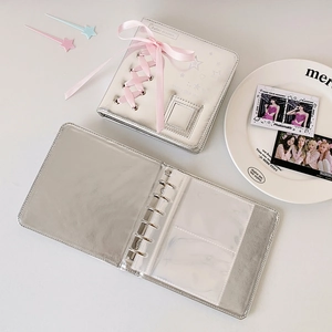 Detailed view of silver metallic A5 binder with pink ribbon and 6-hole inner card sleeves