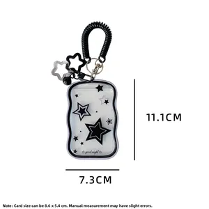 Detail of transparent star pattern card holder with black spring wristband and star charm